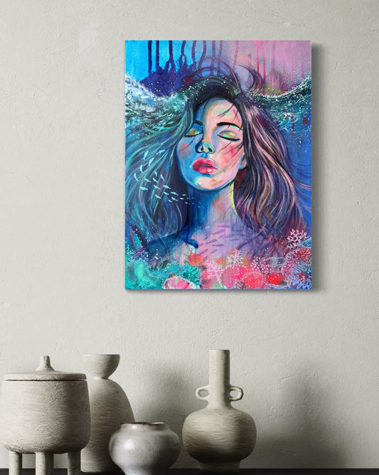 Blue and modern portrait artwork of a woman with long hair in an underwater setting on a wall with white decorative vases below