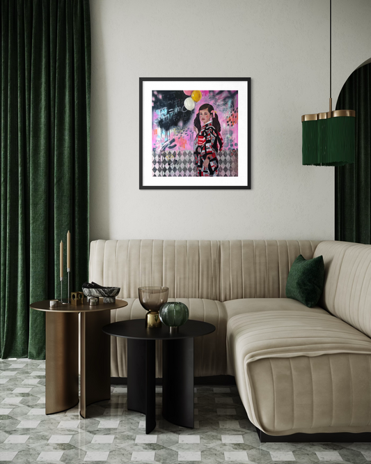 Modern living room with a beige sofa, side tables, and a framed artwork on the wall.