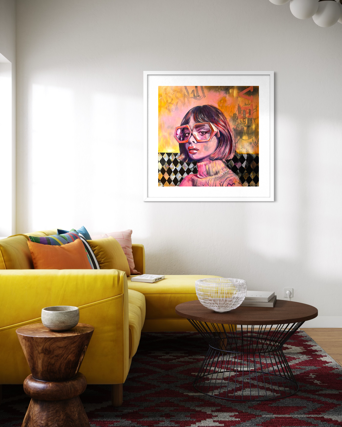 Living room with a yellow sofa, wooden coffee table, and colourful wall art of a painting of an woman with oversized glasses.