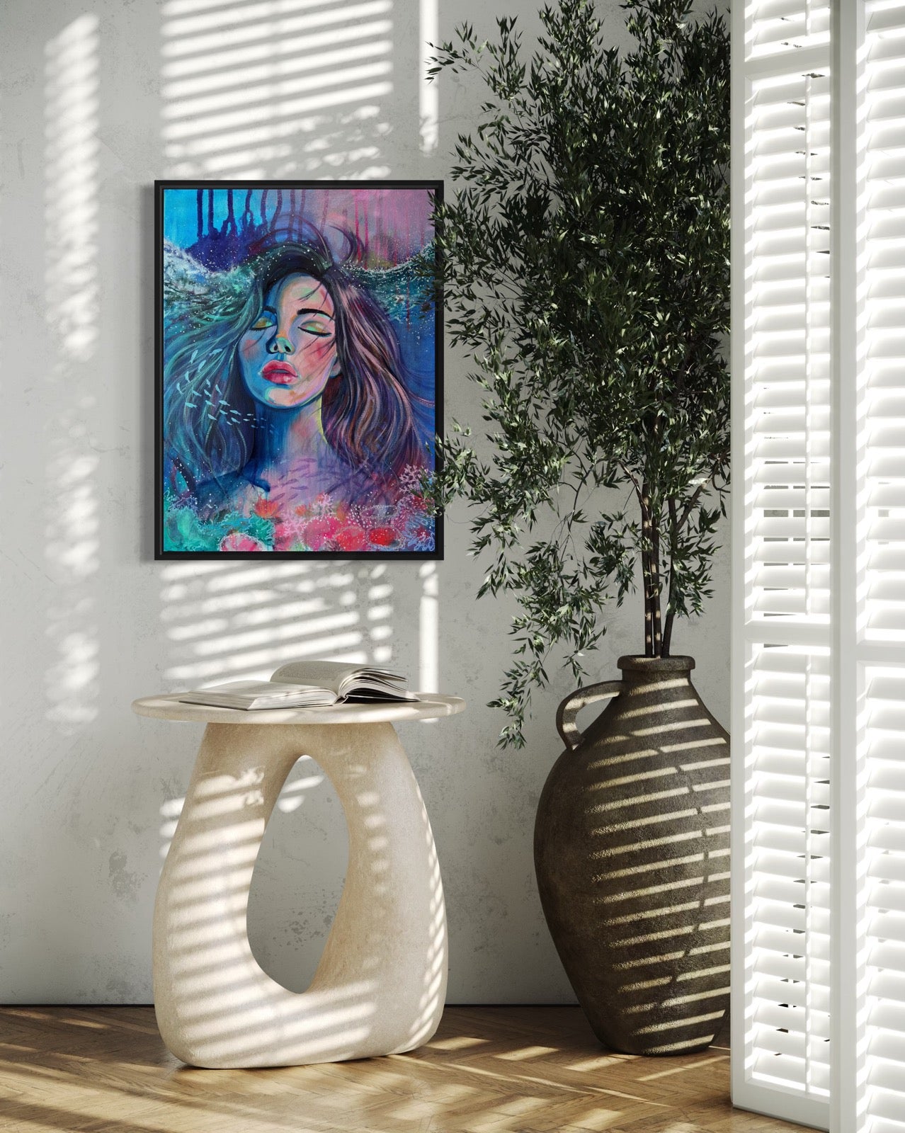 Blue and modern portrait artwork of a woman with long hair in an underwater setting on a wall with a vase and plant below.