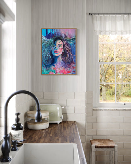 Blue and modern portrait artwork of a woman with long hair in an underwater setting on a wall of a rustic kitchen bench.