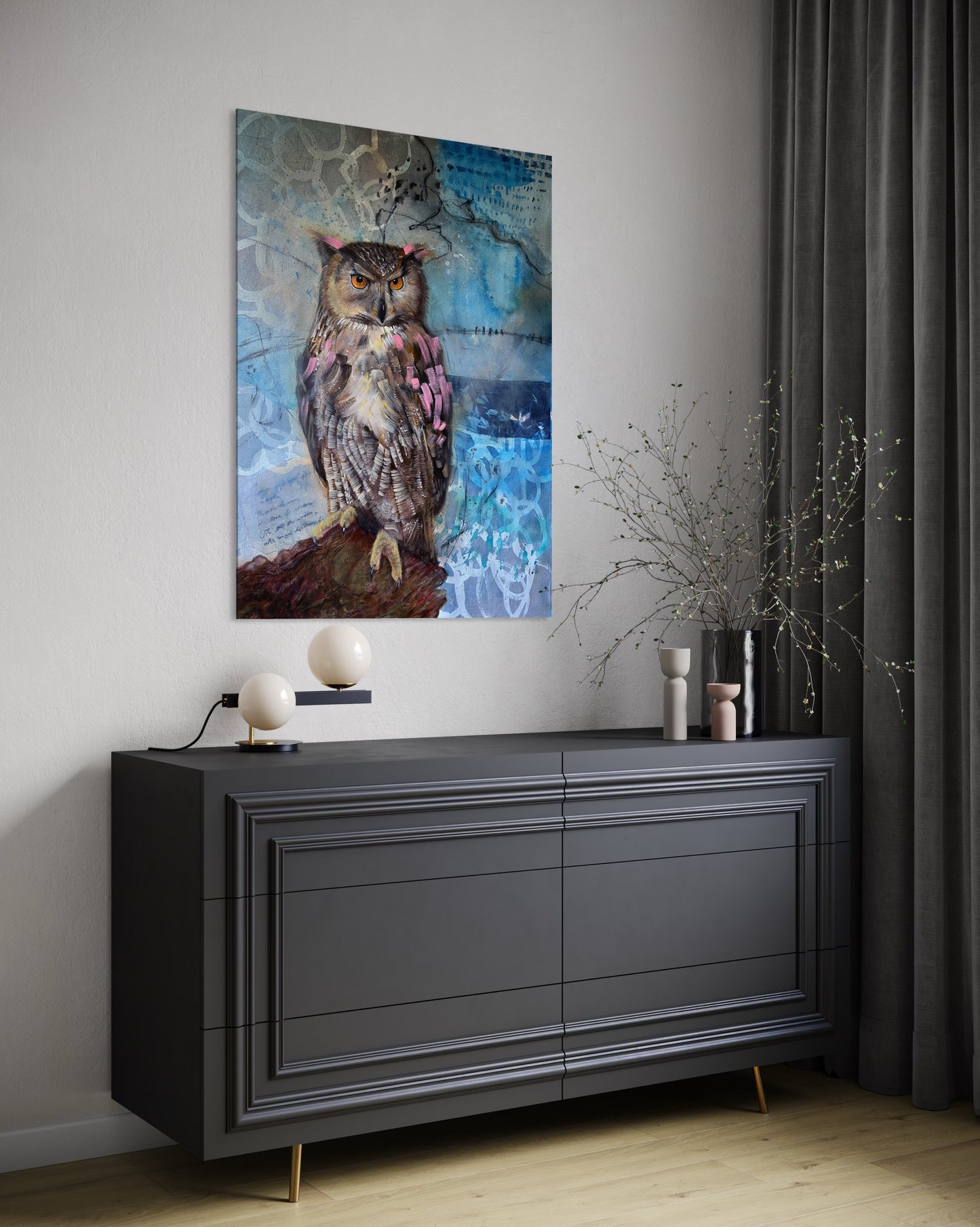 Contemporary owl wall art print displayed on a modern console with plant vase and decor, featuring a detailed owl with orange eyes in a textured blue background.