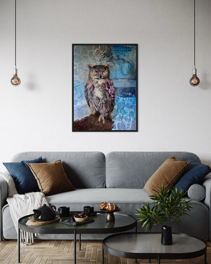 Living room with a gray sofa, decorative pillows, and a framed owl painting on the wall.