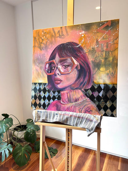 Vibrant portrait painting of a woman with glasses on an easel in a room with plants