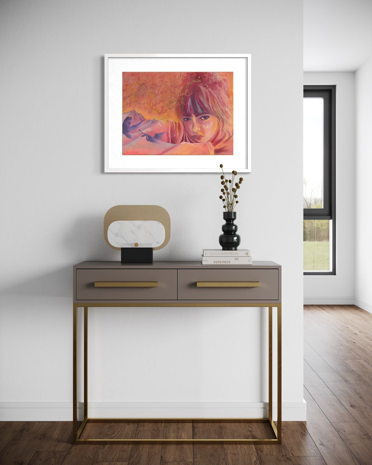 Modern interior with a console table and framed artwork on a white wall.