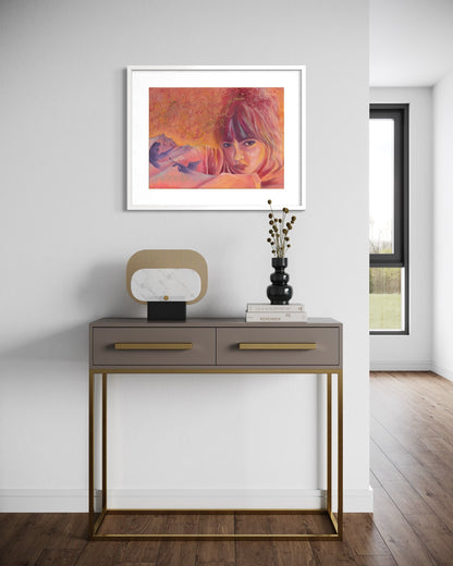 Modern interior with a console table and framed artwork on a white wall.