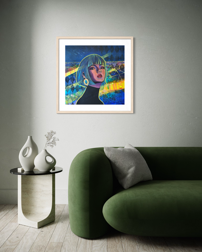 Framed artwork of a contemporary portrait painting inspired by Paris at night with vibrant blue, green and yellow tones, on a wall above a green sofa.