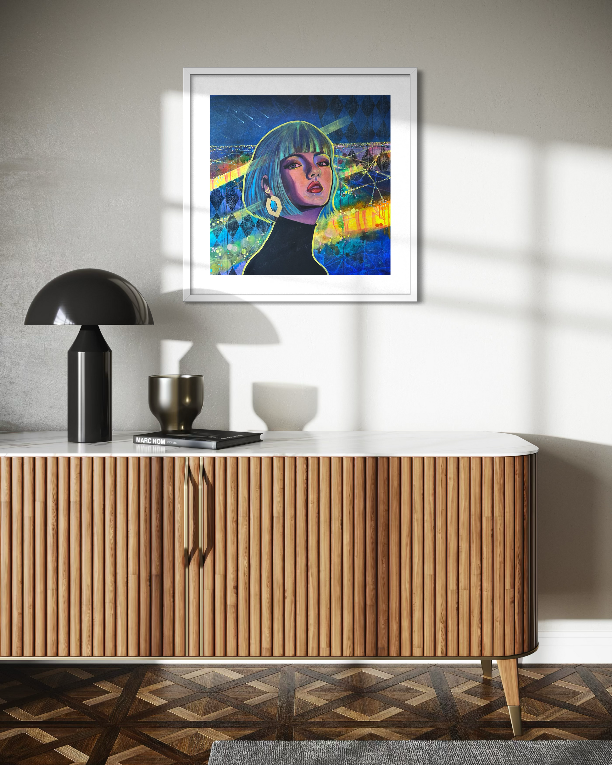 Wooden sideboard with a contemporary portrait painting inspired by Paris at night with vibrant blue, green and yellow tones above it, on a light grey wall.
